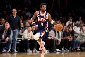 Apr 8, 2022; Brooklyn, New York, USA; Brooklyn Nets guard Kyrie Irving (11) brings the ball up court against the Cleveland Cavaliers during the fourth quarter at Barclays Center. Mandatory Credit: Brad Penner-USA TODAY Sports