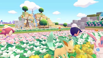 Personajes humanos y Pokémon (Leafeon, Sylveon) en un campo de flores rosas y blancas. Fondo con molinos de viento, árboles y cascadas bajo un cielo azul claro