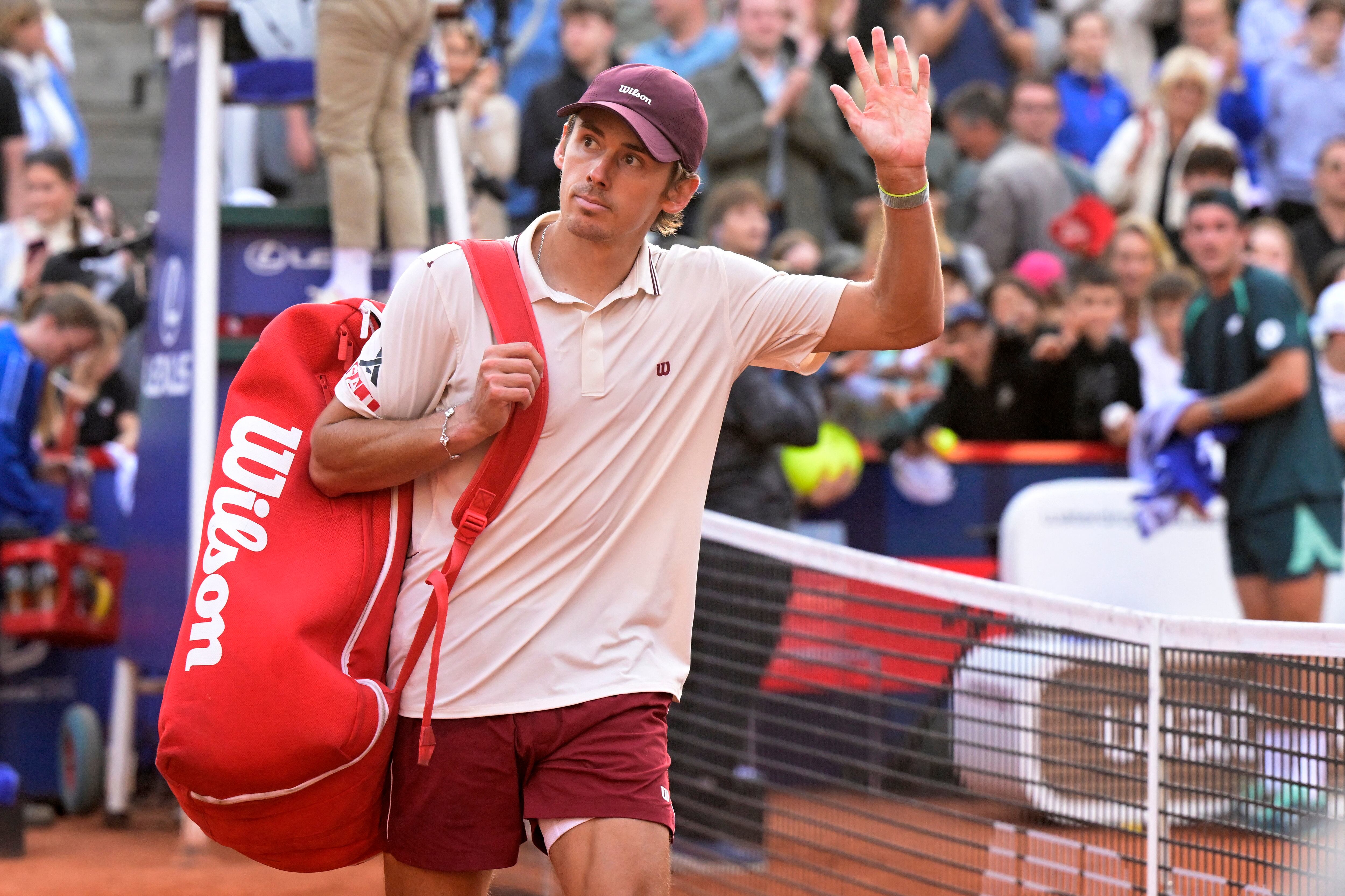 Tennis - ATP 500 - Hamburg Open - Am Rothenbaum, Hamburg, Germany - May 22, 2026 Australia's Alex de Minaur looks dejected after losing his semi final match against Tommy Paul of the U.S. REUTERS/Fabian Bimmer