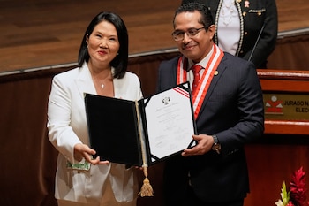 Peru's President-elect Keiko Fujimori, left, receives her credentials from National Elections Board President Roberto Burneo in Lima, Peru, Wednesday, July 15, 2026. (AP Foto/Martín Mejía)