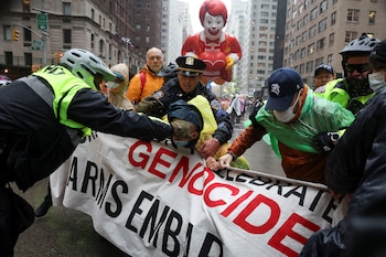 Police officers clash with protesters