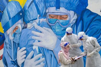 Health workers wearing personal protective