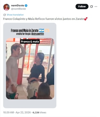 Una imagen de baja resolución muestra a Franco Colapinto y Maia Reficco de pie en un interior, el hombre con camisa clara y la mujer con una oscura