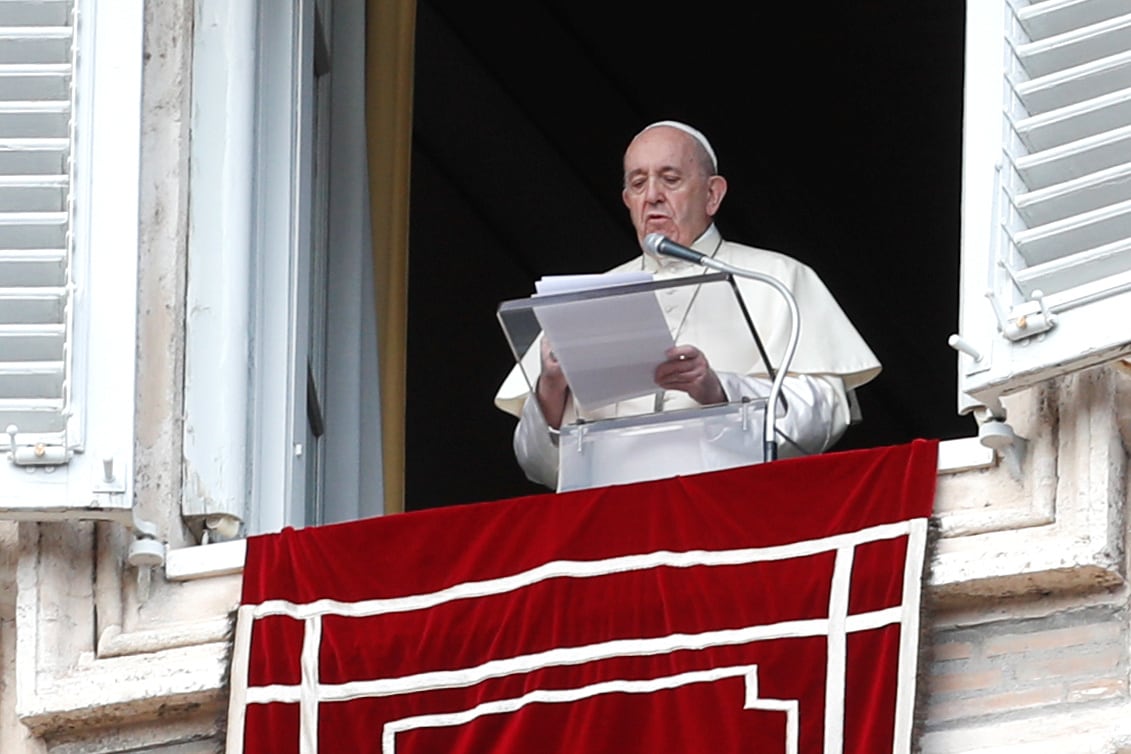 Pope Francis delivers the Angelus prayer from his window on the day of the release of his new encyclical, titled