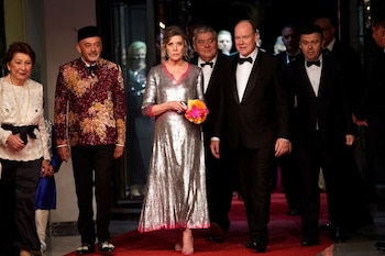 Christian Louboutin, second from left, Princess Caroline of Hanover, Prince Albert II of Monaco, and Stephane Valeri attend the 'Bal de la Rose' (Rose Ball), in Monaco, March 25, 2023. Daniel Cole/Pool via REUTERS