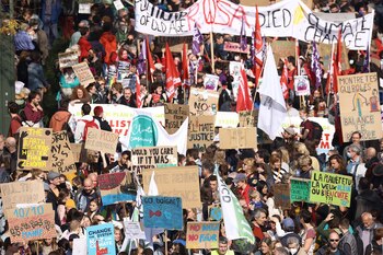 Protesters take part in a demonstration against climate change in Brussels, on October 10, 2021, ahead of the COP26 climate summit. - The COP26 climate summit is held from October 31 to November 12, 2021. (Photo by Kenzo Tribouillard / AFP)