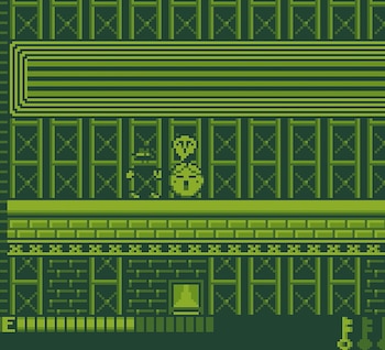 Gráficos pixelados en tonos de verde con dos personajes en una plataforma, un marco rectangular arriba y una barra con la letra E abajo