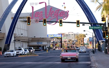 Elvis Presley tribute artist Jesse Garon heads northbound on the Las Vegas Strip in his 1960 Cadillac convertible after a marriage marriage vow renewal ceremony at Little Chapel of Hearts in Las Vegas, Nevada, U.S. June 1, 2022. REUTERS/Steve Marcus