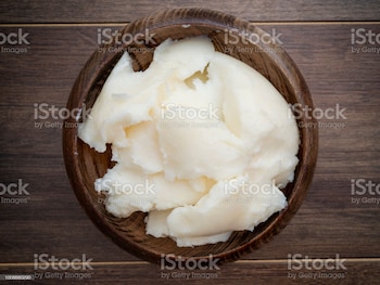 Pork fat in wooden plate, top view