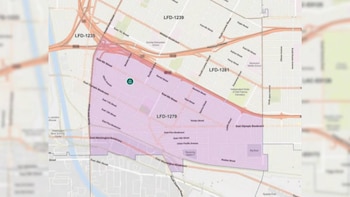 Mapa digital de un área urbana con calles, autopistas y distritos etiquetados LFD. La zona LFD-1279 está sombreada de morado, con un pin verde marcando una ubicación