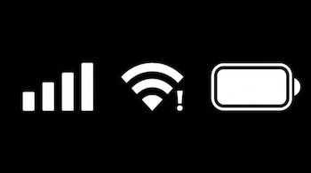 Cuatro barras de señal, un icono de WiFi con un signo de admiración y un icono de batería rectangular vacía, sobre un fondo negro.