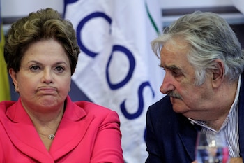 FILE PHOTO: Uruguay's President Jose Mujica looks at Brazil's President Dilma Rousseff during a media statement after a meeting of the presidents at the Special MERCOSUR Summit at the Planalto Palace in Brasilia, Brazil, July 31, 2012. REUTERS/Ueslei Marcelino/File Photo