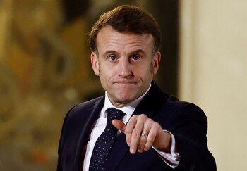 French President Emmanuel Macron gestures