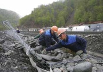 Workmen perform construction at the