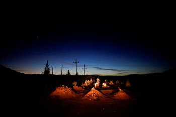 The graves of Rhonita Miller and four of her children who were killed by unknown assailants, lie in a cemetery in LeBaron, Mexico, December 21, 2019. REUTERS/Alexandre Meneghini