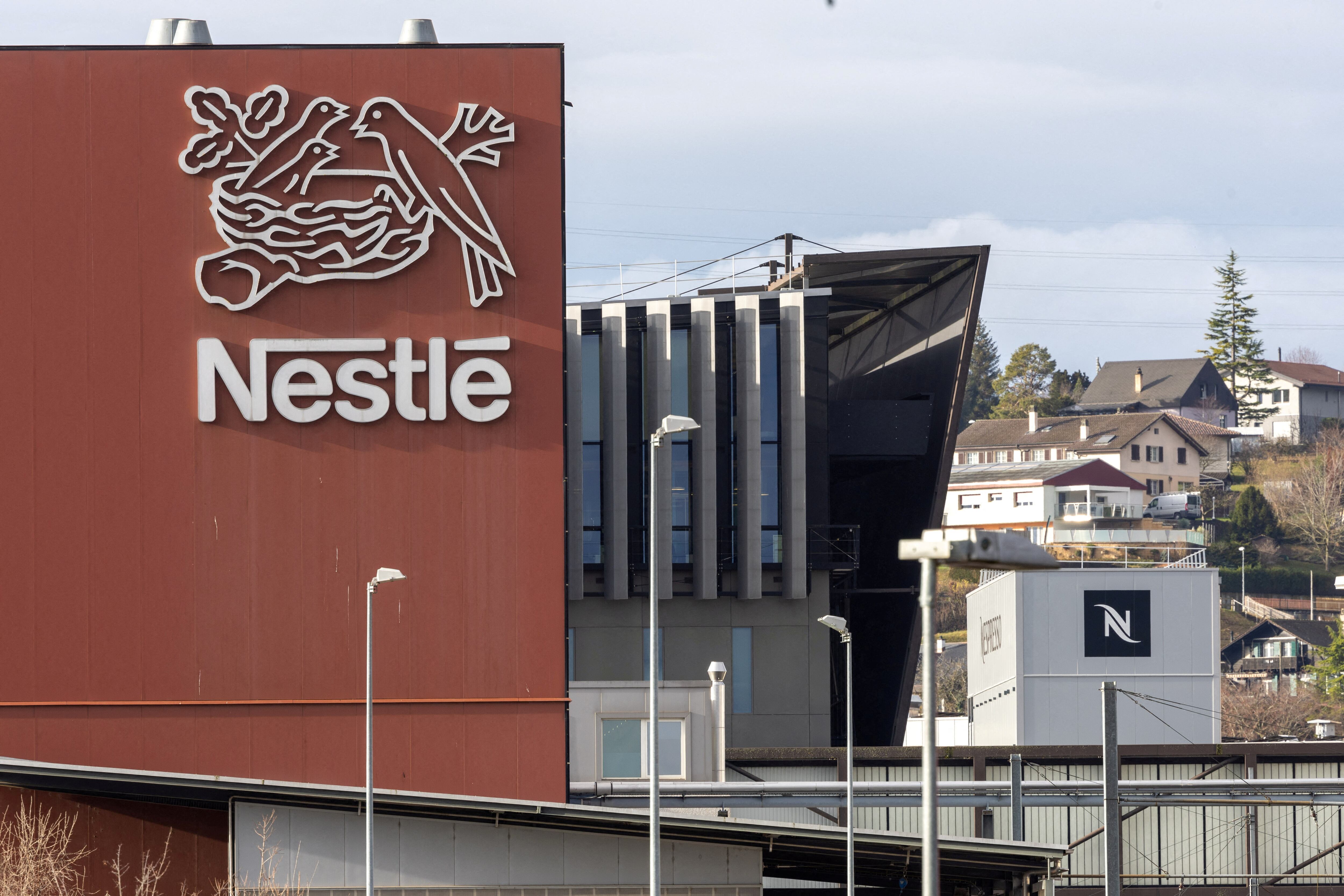 FILE PHOTO: A logo of food giant Nestle is seen in a building in Orbe, Switzerland, February 9, 2024. REUTERS/Denis Balibouse/File Photo