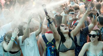 FILE PHOTO: Concertgoers are sprayed