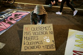 A person holds a placards