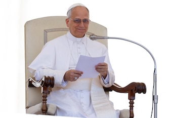 Pope Leo XIV holds the