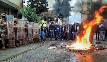 Army soldiers stand guard as