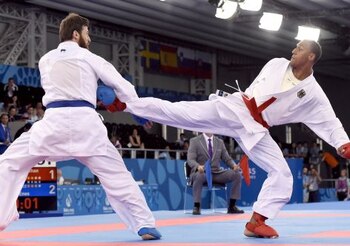 Turkey's Enes Erkan (L) competes