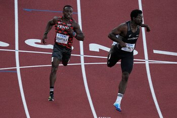 Ferdinand Omanyala, left, of Kenya,