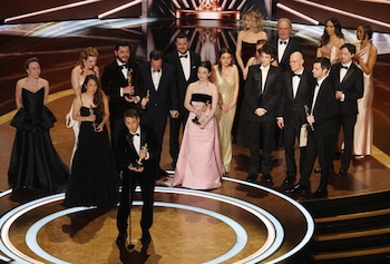 Director Sean Baker accepts the Oscar for Best Picture for "Anora" as producers Producer Samantha Quan and Alex Coco, and Best Actress in a Leading Role winner Mikey Madison look on during the Oscars show at the 97th Academy Awards in Hollywood, Los Angeles, California, U.S., March 2, 2025. REUTERS/Carlos Barria