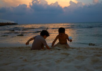 Children play on the seashore,