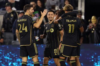 Feb 25, 2025; Los Angeles, California, USA; LAFC midfielder Marco Delgado (8) celebrates with teammates after scoring a goal against the Colorado Rapids during the second half of Concacaf Champions Cup Round 1 match at BMO Stadium. Mandatory Credit: Kiyoshi Mio-Imagn Images