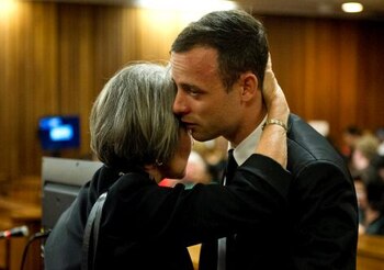 PRETORIA, SOUTH AFRICA - APRIL 07: (SOUTH AFRICA OUT) Oscar and Aimee Pistorius at the Pretoria High Court on April 7, 2014, in Pretoria, South Africa. Pistorius, stands accused of the murder of his girlfriend, Reeva Steenkamp, on February 14, 2014. This is Pistorius' official trial, the result of which will determine the paralympian athlete's fate. (Photo by Deaan Vivier - Pool/Getty Images)