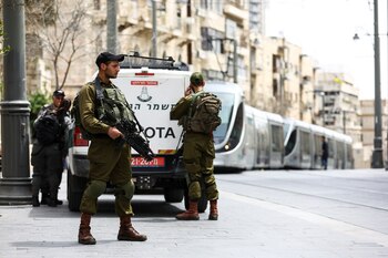 Israeli soldiers secure a public