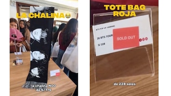 Una bufanda negra sobre una mesa de madera junto a un letrero transparente que indica el precio y el estado de agotado de un producto