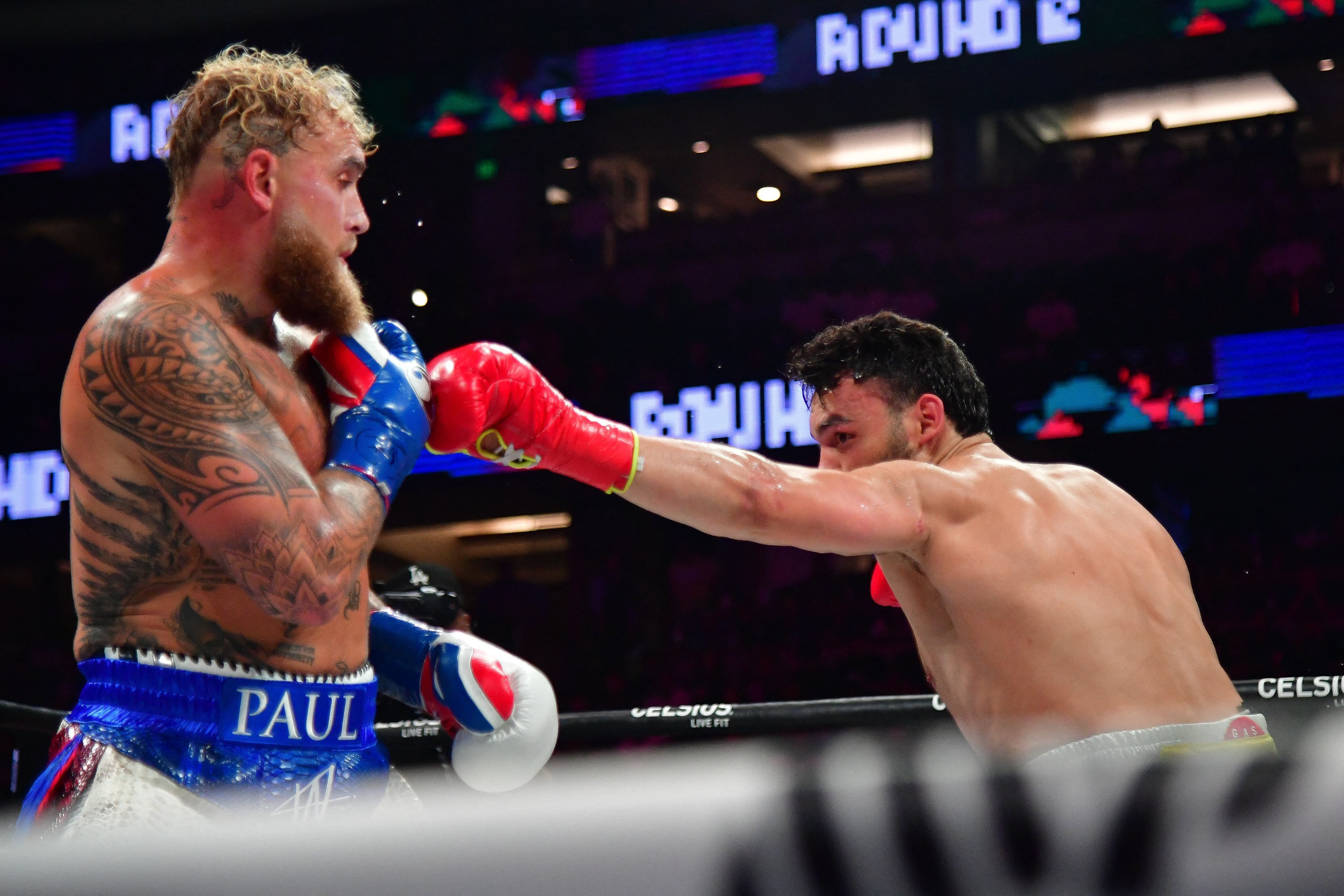 Jun 28, 2025; Anaheim, California, USA; Jake Paul fights against Julio Cesar Chavez Jr. at Honda Center. Mandatory Credit: Gary A. Vasquez-Imagn Images
