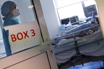 A medical staff member, wearing