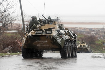 Service members of pro-Russian troops