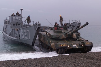 POHANG, Korea (Oct. 29, 2000) -- Landing Craft Utility 1627 prepares to land and unload Republic of Korea forces and cargo, along with U. S. soldiers from Okinawa, Japan. The combined amphibious beach assult at Tak San Ri Beach near Pohang, is in support of exercise Foal Eagle 2000. Foal Eagle is the largest Joint and Combined field training drill conducted annually in South Korea, running from Oct. 25th to Nov. 3rd. About 25,000 U.S. troops will take part in the drill, including active duty, Reserve and National Guard troops from bases in the United States and elsewhere in the Pacific. The exercise demonstrates U.S. and South Korean military cooperation. (U.S. Air Force photo by Tech. Sgt. James E. Lotz) (Released)
