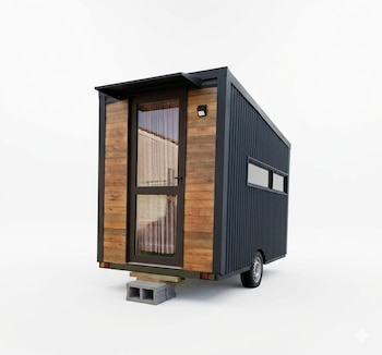 Casa miniatura con fachada de madera de contrachapado y puerta de cristal. Lateral de metal corrugado oscuro y dos ventanas. Descansa sobre bloques de hormigón