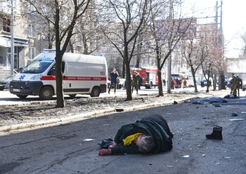 SENSITIVE MATERIAL. THIS IMAGE MAY OFFEND OR DISTURB The body of a woman killed during shelling lies on a street in the separatist-controlled city of Donetsk, Ukraine March 14, 2022. REUTERS/Stringer