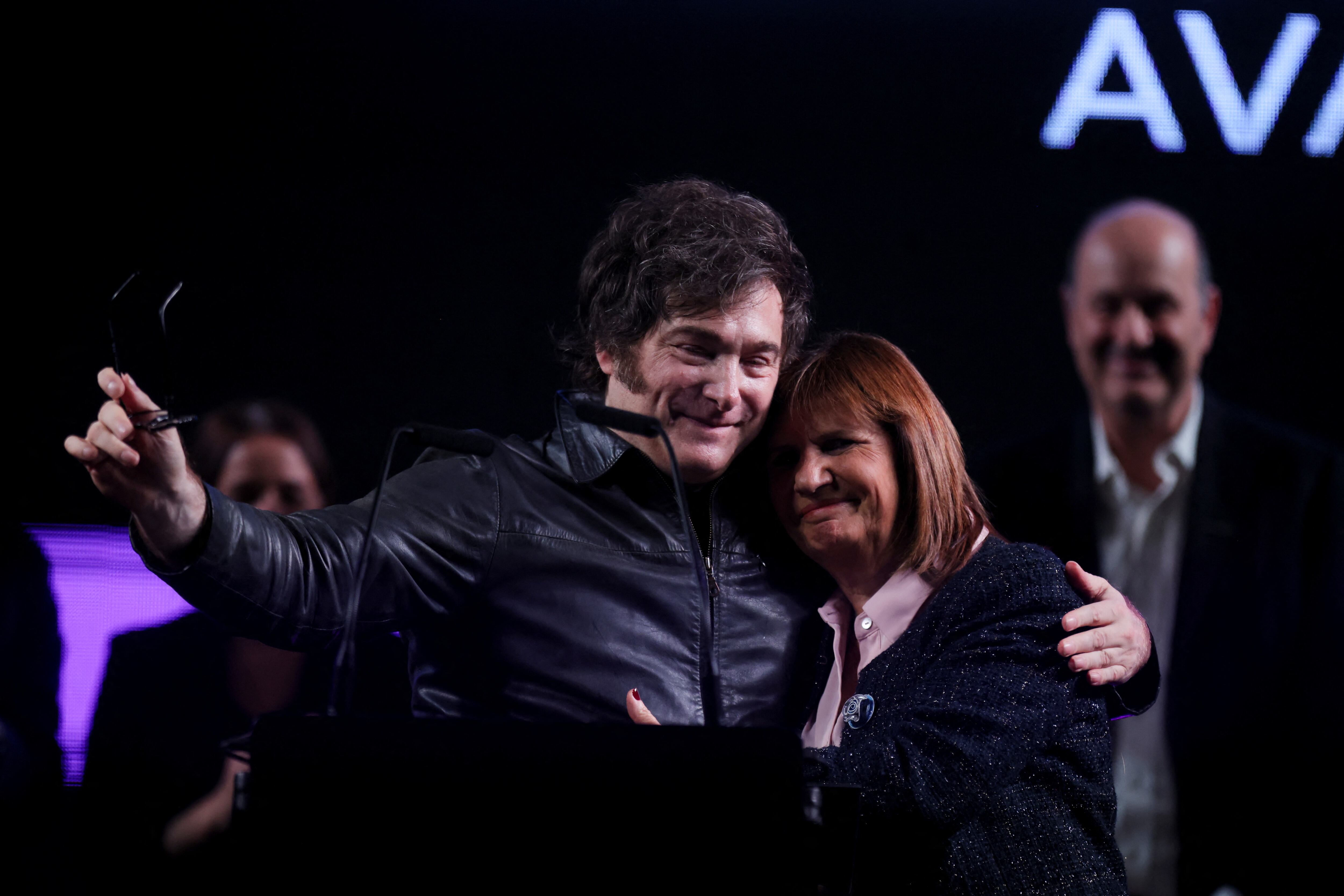 Argentina's President Javier Milei and Security Minister Patricia Bullrich embrace during a rally in Buenos Aires, Argentina, May 14, 2025. REUTERS/Tomas Cuesta