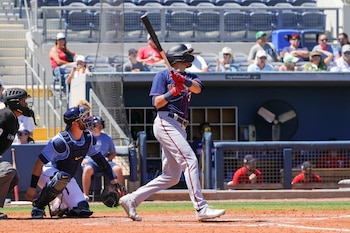 Mar 29, 2022; Port Charlotte, Florida, USA; Minnesota Twins left fielder Trevor Larnach (13) doubles during the fifth inning against the Tampa Bay Rays during spring training at Charlotte Sports Park. Mandatory Credit: Mike Watters-USA TODAY Sports