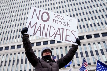 FILE PHOTO: People attend a