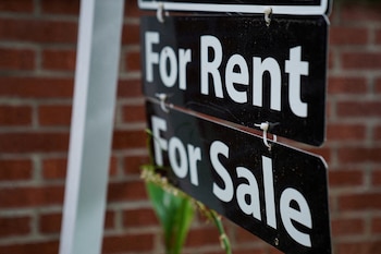 FILE PHOTO: A "For Rent, For Sale" sign is seen outside of a home in Washington, U.S., July 7, 2022. REUTERS/Sarah Silbiger/File Photo/File Photo