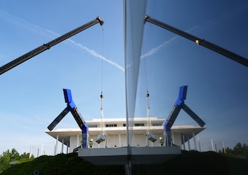 Workers remove “Blue,” a 24-foot sculpture by the artist Joel Shapiro, from the grounds of the Kennedy Center in Washington, on Wednesday, Sept. 2, 2026. The Kennedy Center confirmed in a statement that the sculpture was being deinstalled and that a foundation dedicated to the artist would determine its next location. It did not say the reason for the removal but noted that the deinstallation of artworks that had been donated or lent was common practice for conservation or preservation purposes. (Salwan Georges/The New York Times)
