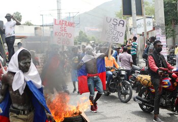 Demonstrators march during protests demanding