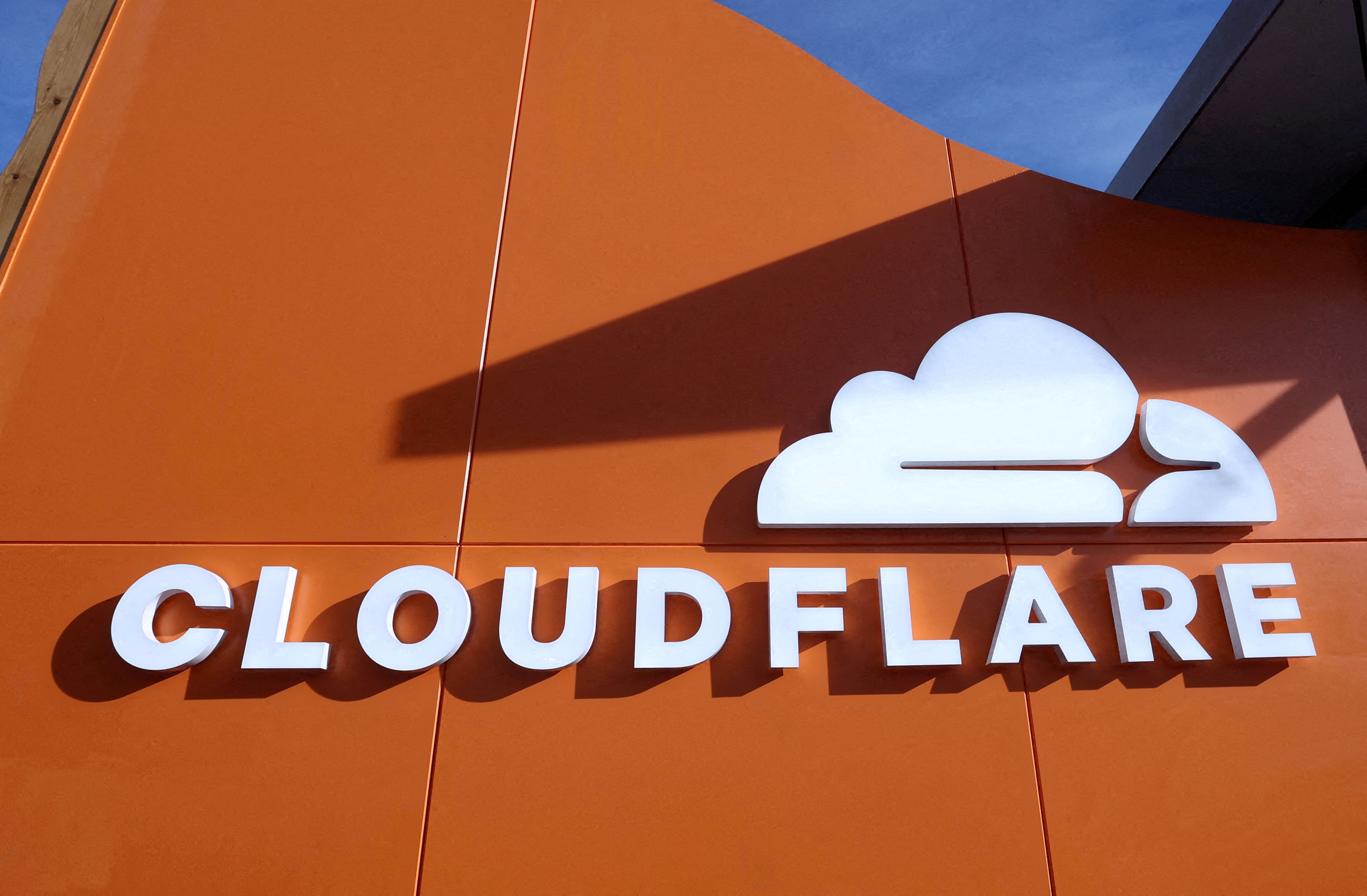 FILE PHOTO: A logo of CLOUDFLARE sits outside the company's house on the opening day of the 55th annual meeting of the World Economic Forum (WEF) in Davos, Switzerland, January 20, 2025. REUTERS/Yves Herman/File Photo