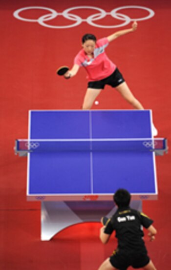 Li Jia Wei of Singapore (top) hits a return against China's Guo Yue (bottom) during their women's table tennis singles bronze medal match at the 2008 Beijing Olympic Games on August 22, 2008. Guo won the match 4-2 to take home the bronze. AFP PHOTO/ PEDRO UGARTE (Photo credit should read PEDRO UGARTE/AFP/Getty Images)