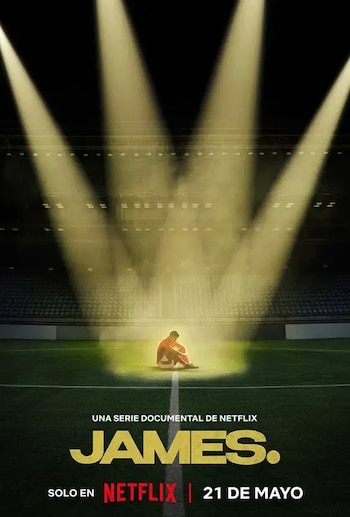 Un póster promocional muestra a un hombre sentado solo en el centro de un campo de fútbol bajo potentes focos en un estadio vacío con el título 'JAMES.'