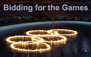 ATHENS, Greece: A fire of the Olympic rings are lit in a pool in the Athens Olympic Stadium during the 2004 summer games opening ceremony, 13 August 2004. Some 10,000 athletes representing 202 countries will march together in front of 70,000 spectators during the spectacular opening, kicking off a fortnight of sporting competition that is costing 5.8 billion euros (7.2 billion dollars) to stage. AFP PHOTO / ARIS MESSINIS (Photo credit should read Aris MESSINIS/AFP/Getty Images)