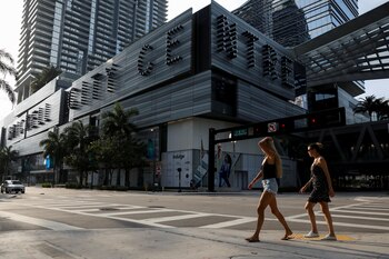 Women walk across an empty