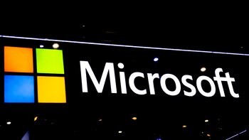 BARCELONA, SPAIN - FEBRUARY 28: A logo sits illuminated outside the Microsoft booth at the SK telecom booth on day 1 of the GSMA Mobile World Congress on February 28, 2022 in Barcelona, Spain. The annual Mobile World Congress hosts some of the world's largest communications companies, with many unveiling their latest phones and wearables gadgets like foldable screens. (Photo by David Ramos/Getty Images)